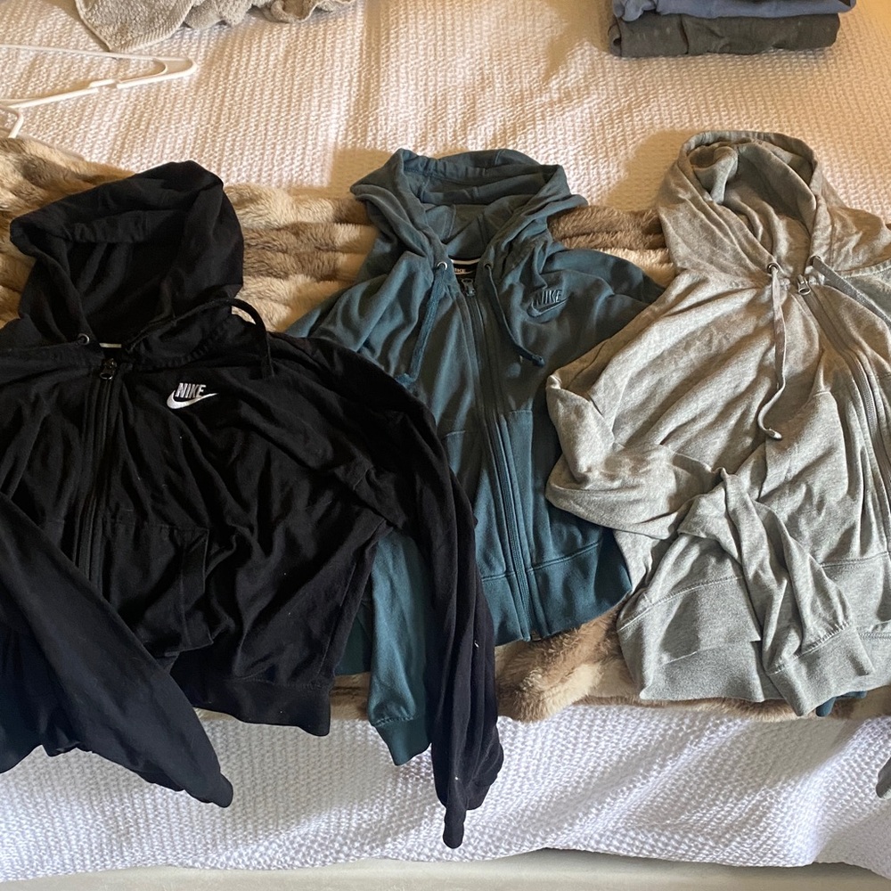 Nike Trio of Black, Teal, and Gray Hoodies (cropped)